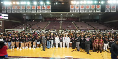 Picture of Academic Distinction Students on the Court for "Storm the Court"